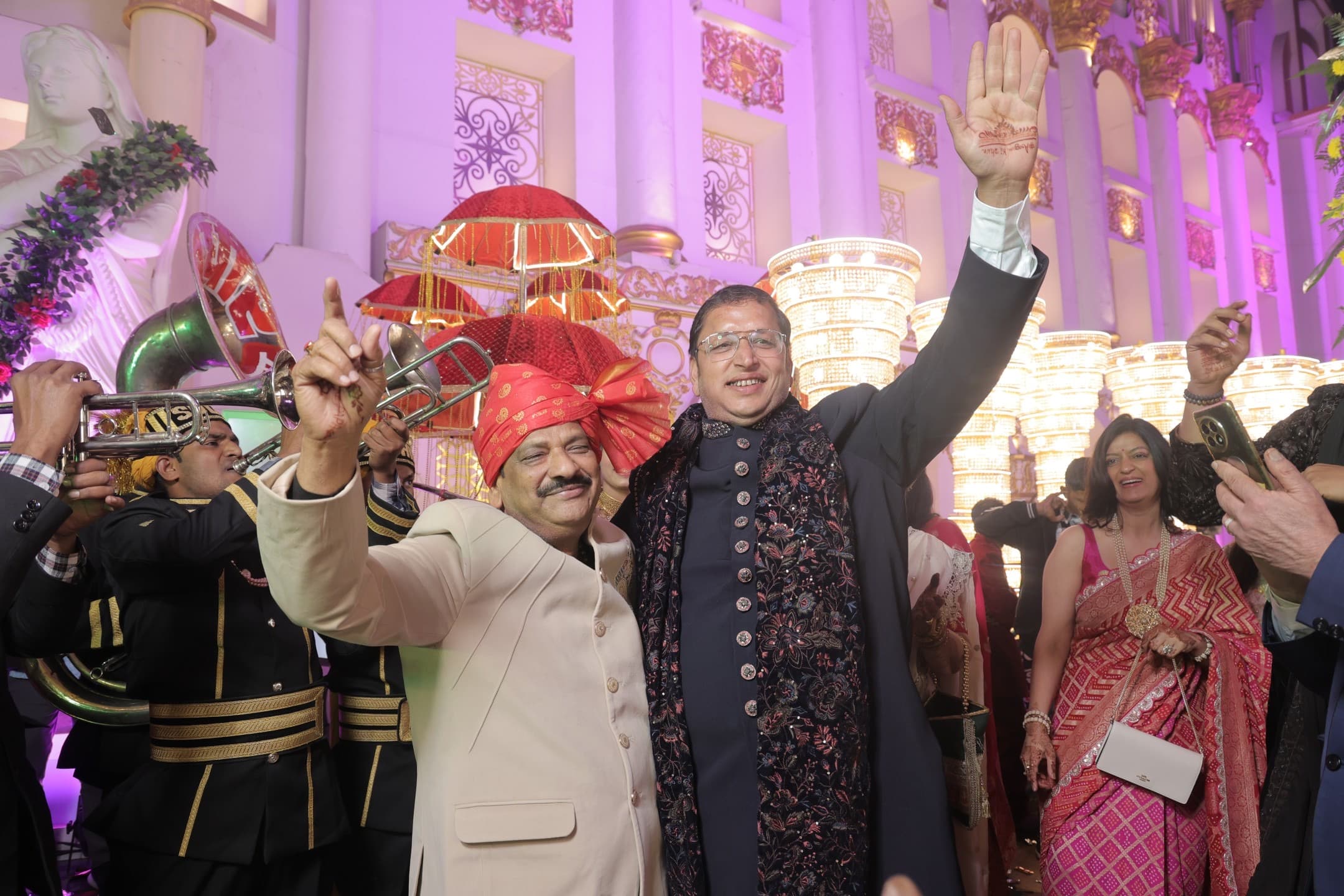 Both fathers celebrating together at the baraat