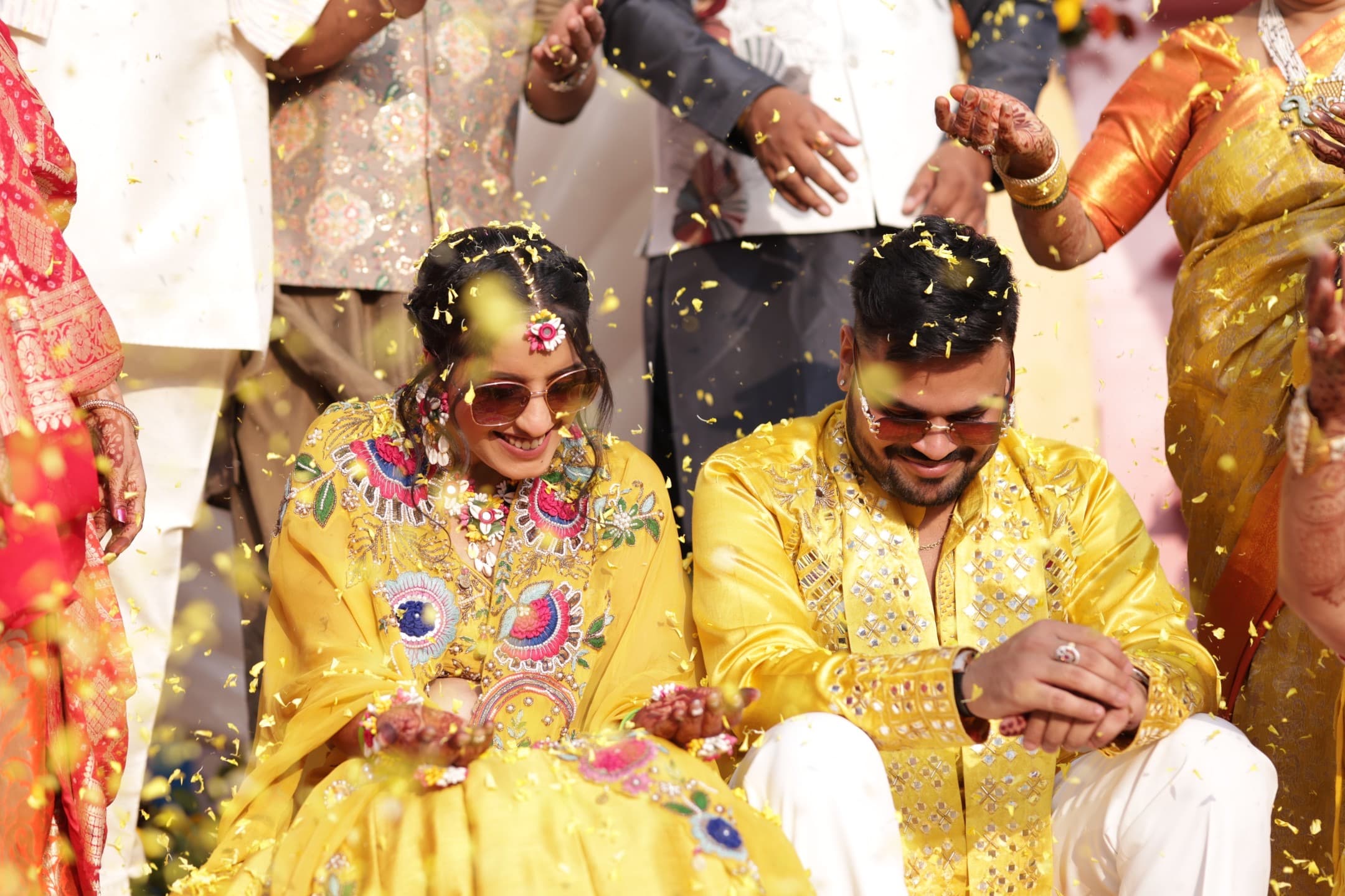 Haldi ceremony — turmeric being applied to the couple